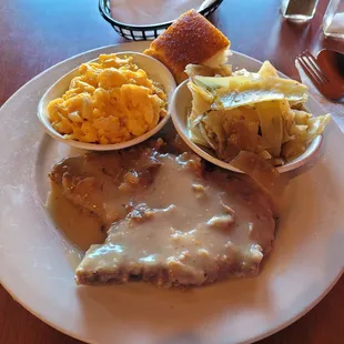 Deep-fried smothered pork chop, Grandma Shirley&apos;s cabbage, Momma&apos;s mac n cheese, and cornbread.
