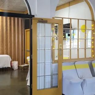 a woman entering a room with a bed