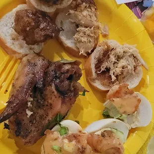 Baked chicken wings, deviled egg with Cajun shrimp on top, salmon croquet casserole on sour dough, REAL meatballs
