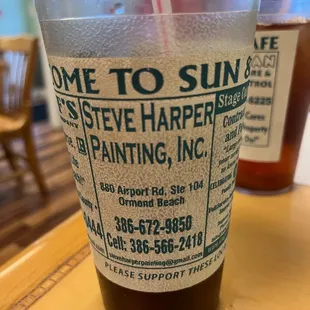 a plastic cup with a straw