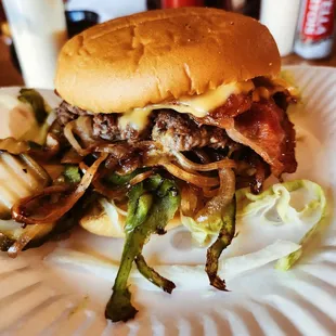 Onion burger with jalapeños, bacon, and cheese.