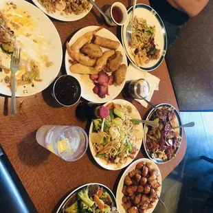 Hong Kong style fried rice Sun China Special House Noodles Appetizer plate Broccoli and beef Orange chicken Magnolias Beef