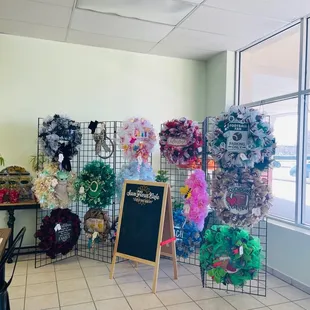 Wreaths for sale are made by a regular patron. The proceeds of the sales go toward funding her chemo treatments.