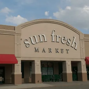 a storefront with a red awning