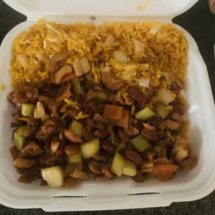 a takeout container with rice and vegetables