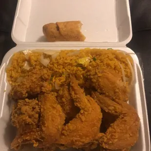 a container of fried chicken and rice