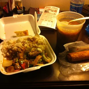 Beef with vegetables, Hot and sour soup, and an eggroll.