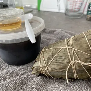 Left: Grass Herbal Jelly dessert (small) with a simple syrup on the side.  Right: Zongzi