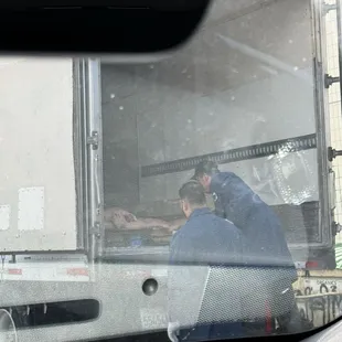 Just drove by &amp; seen a dead full body of a pig and raw meat just on top of cardboard boxes. NOT stored properly or SAFELY.