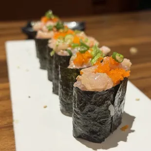 sushi rolls on a white plate