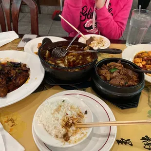Eggplant with garlic sauce, spicy fish pot, beef brisket in clay pot and ma po tofu.