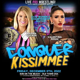 two women in front of a ferris wheel