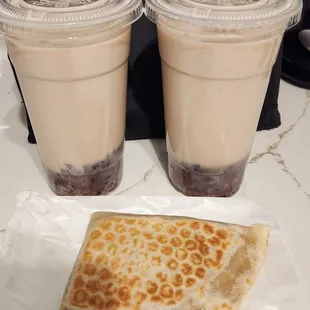 two cups of coffee and a sandwich