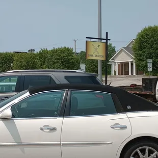 a white car in a parking lot