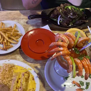Shrimp Cocktail enchiladas with carne guisada rice and beans