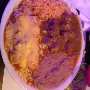 Plato Sol. Two enchiladas,   carne guisada, rice and beans.