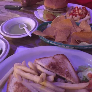 A chicken sandwich with fries