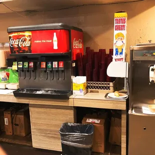 a soda machine and a soda dispenser