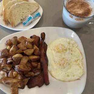 Classic breakfast and a chai tea latte with vanilla from the small cupcake &amp; latte shop inside