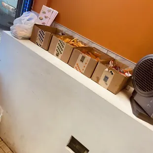 boxes of food on a counter in a restaurant