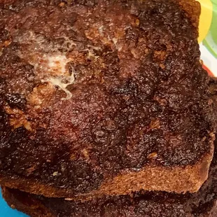 a stack of brownies on a paper plate