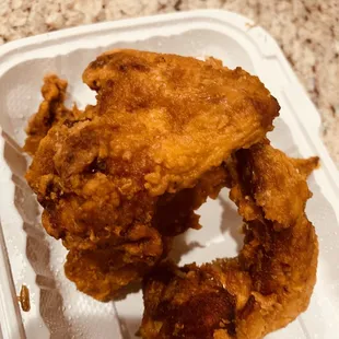 fried chicken in a styrofoam container