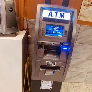 a atm machine with a blue light