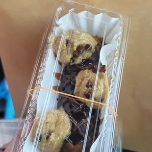 Chocolate mochi waffle on a stick with chocolate chip cookie dough