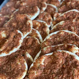 a tray of homemade pizzas
