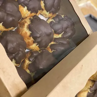 a box of chocolate covered pastries