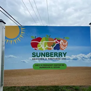 a sign for sunberry orchard and pastures