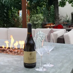 3 stunning romantic patios at Suncafe! A fire table, sit under our 40 foot healing tree