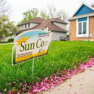 a yard sign in front of a house