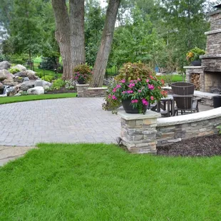 a brick patio with a fire place
