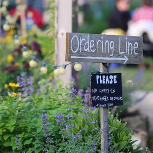 Order from the window and then make camp in the yard while you wait for your pizza