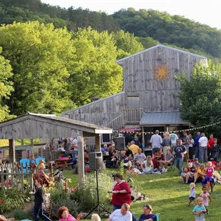 Music in the picnic shelter and guests at the farm