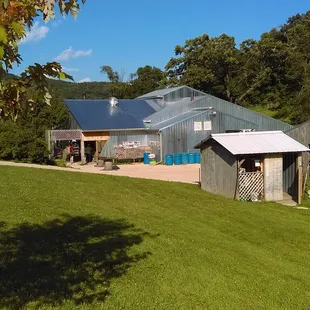 A view of the outhouse and the backside of the barn.
