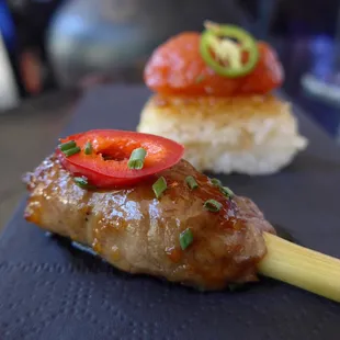 The fantastic lemongrass beef sirloin lollipops and delicious Signature Crispy Rice Spicy Tuna in the back. Order these two to start!