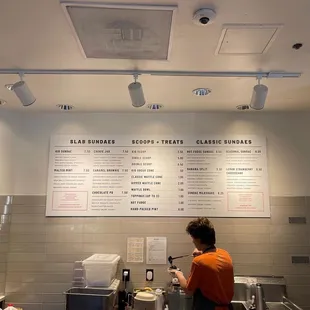 a woman preparing food in a restaurant