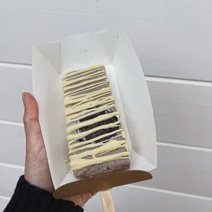 Oreo pop with white chocolate drizzle