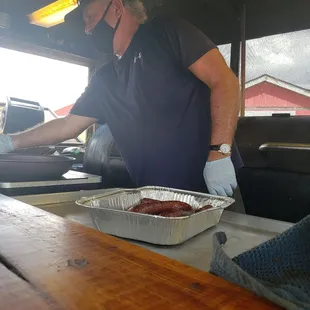 Mike making me a brisket and sausage taco
