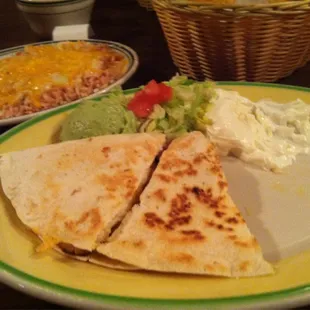 Chicken fajita quesadilla (half eaten)
