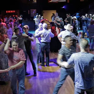 a large group of people dancing