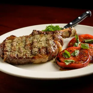 USDA Prime Bone-in Ribeye 24 oz. topped with Steak Butter.