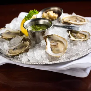 Freshly shucked Canadian Beau Soleil Oysters with Horseradish spiked Cocktail Sauce &amp; Mignonette.