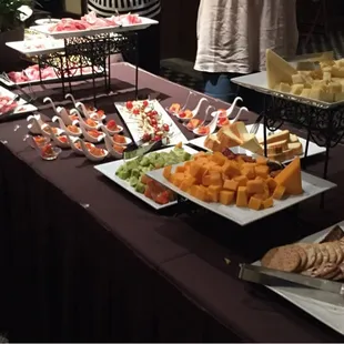 Nice selection of cheeses, meats, and breads.