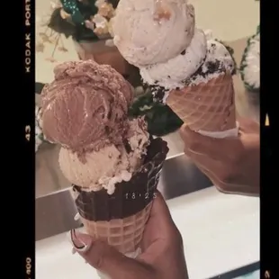 Chocolate moose-tracks with cappuccino crunch in a chocolate cone. Praline pecan with cookies and cream in a vanilla cone.