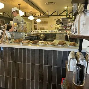 Colton creating my Cortado and pastry offerings.