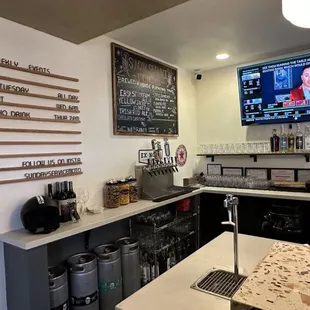 a bar with a television on the wall