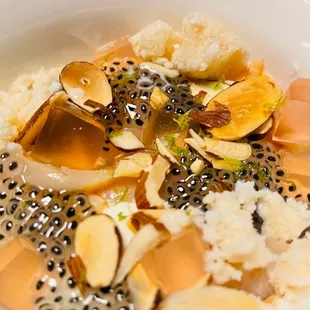 a bowl of food with rice and fruit